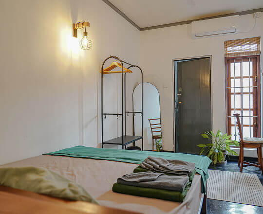 Wall lamp in room 2 hiriketiya coliving accommodation